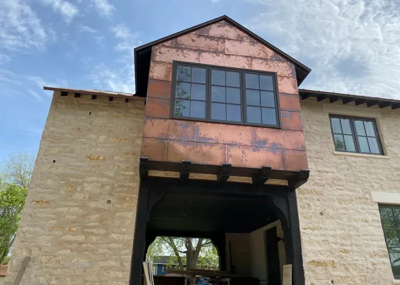 Copper metal panel facade on a stone building for Metal Roof Coating in Delmar